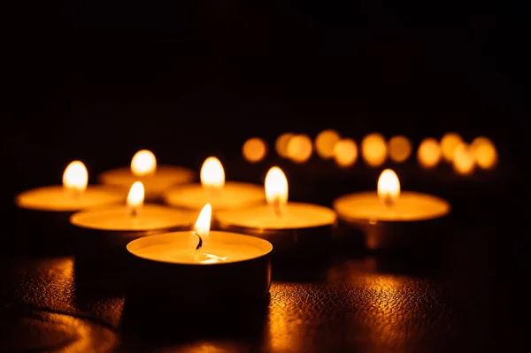 Close Burning Tea Candles Dark Reflection Candlelight Flame — Stock Photo, Image