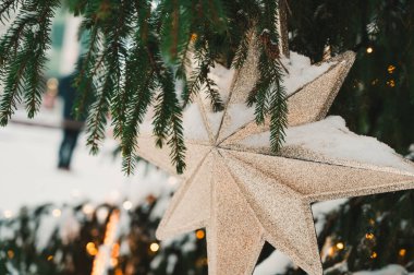 Close-up of decorated Christmas tree on Town Hall square in Riga, Latvia. Winter holiday.