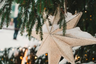 Close-up of decorated Christmas tree on Town Hall square in Riga, Latvia. Winter holiday.