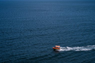 Small pleasure boat in sea. Beautiful summer nature. Black sea. Vacation.