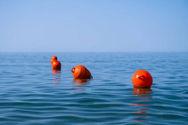 Orange Floating Buoys Sea Human Life Saving Concept Blue Sky — Foto de Stock
