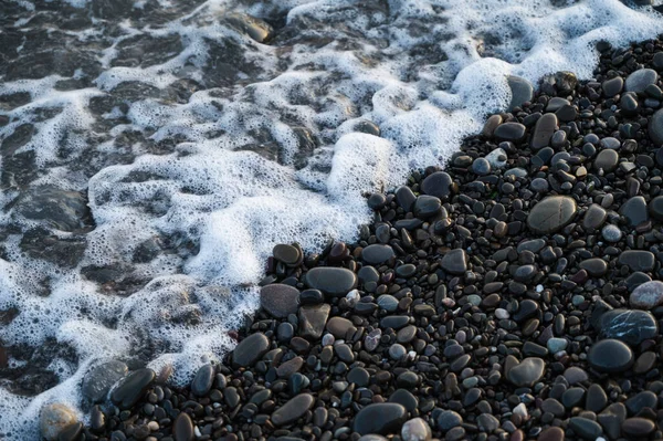 Close Small Stones Pebbled Beach Sea Foam — Foto de Stock