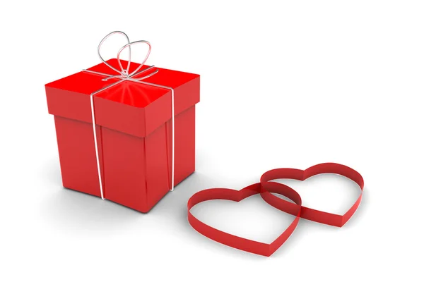 Kırmızı hediye kutusu ve kalpler — Stok fotoğraf