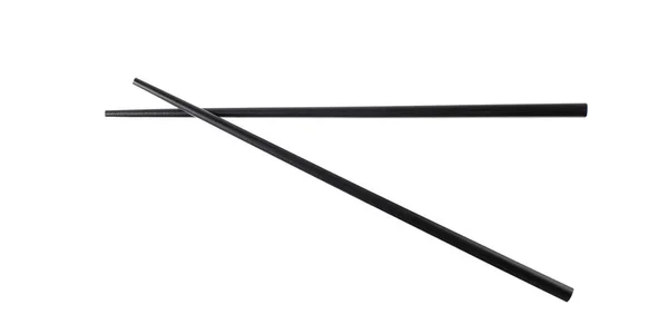 黑色木制筷子在白色背景下隔离飞行 — 图库照片