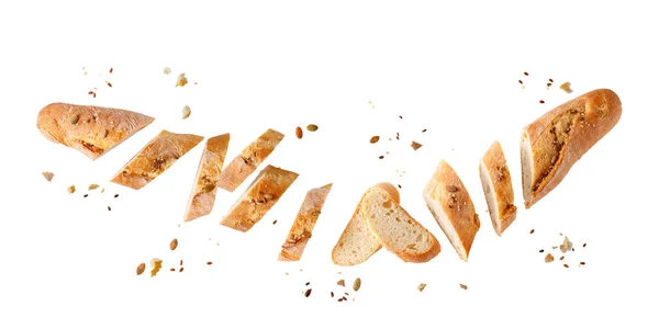 Cutting Fresh Baked Loaf Wheat Baguette Bread Crumbs Seeds Flying — Stock Photo, Image