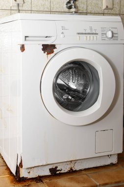 Rust on surface of washing machine. Home appliances wear.