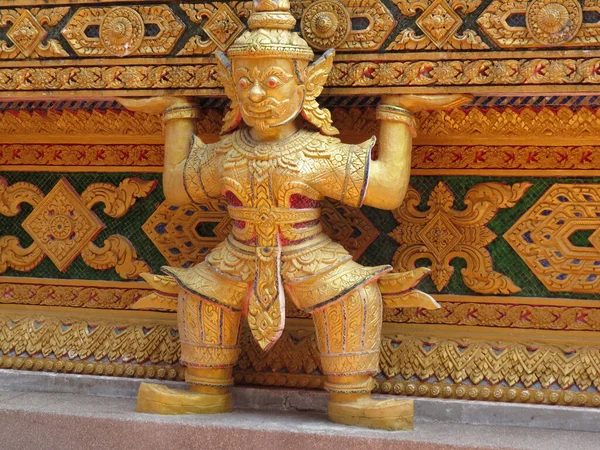 The golden giant guardian demon statue at temple. Wat Bang Riang temple, Thailand