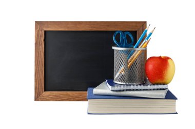 Empty blackboard, school accessories, stack of books and red apple isolated on white background. Education concept.