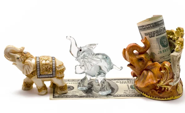 Money with a figurine of an elephant — Stock Photo, Image