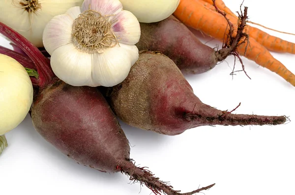 Onions garlic beet and carrots on a white background — Stock Photo, Image