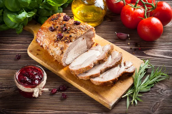 Roasted pork loin with cranberry and rosemary — Stock Photo, Image