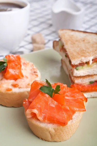 Salmon sandwiches with cup of coffee — Stock Photo, Image