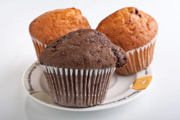 Three muffins on a plate — Stock Photo, Image