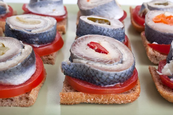 Sandwiches with tomatoes and norwegian herring — Stock Photo, Image