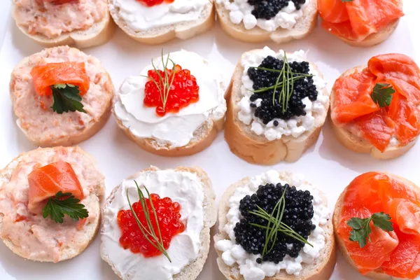 Large group of sandwiches with seafood — Stock Photo, Image