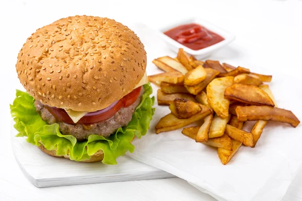 Hamburger with fries and sauce — Stock Photo, Image