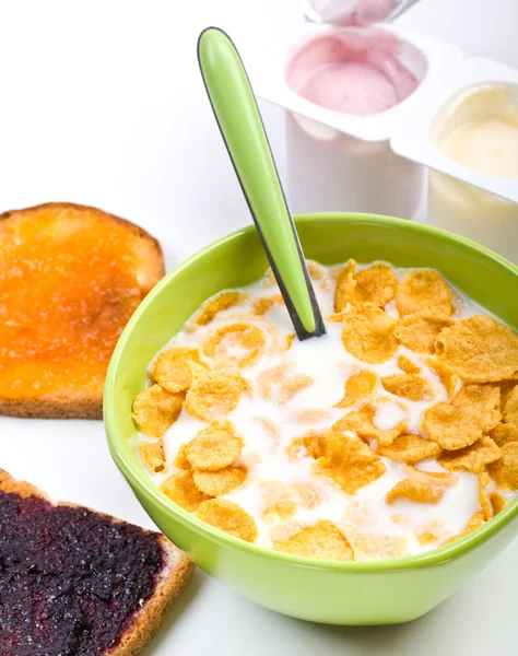 Bowl of cereal with toasts and yougurt — Stock Photo, Image