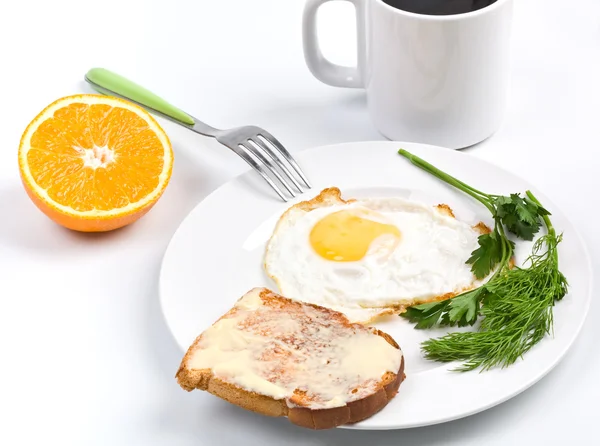 Fried egg, cup of coffee and a toast — Stock Photo, Image