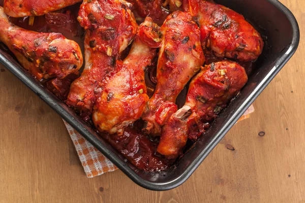 Baked chicken legs with tomato — Stock Photo, Image