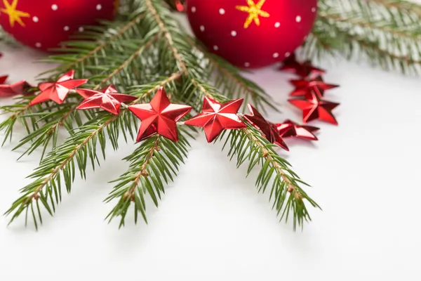 Christmas decorations and fir tree branches — Stock Photo, Image