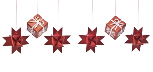 Christmas star shaped decorations and gift boxes — Stock Photo, Image
