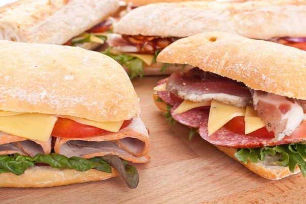 Group of stuffed sub sandwiches on a table — Stock Photo, Image