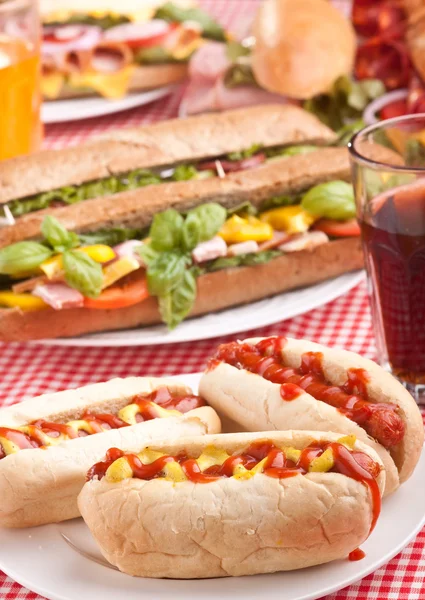 Group of hot dogs, sandwiches  and drink — Stock Photo, Image