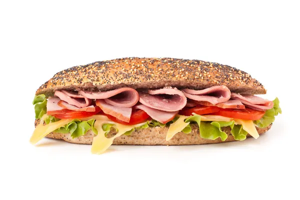 Long whole wheat baguette sandwich with lettuce, tomatoes, ham, — Stock Photo, Image