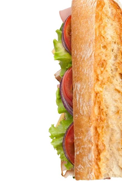 Hälfte des langen leckeren Baguette-Sandwich in der U-Bahn — Stockfoto