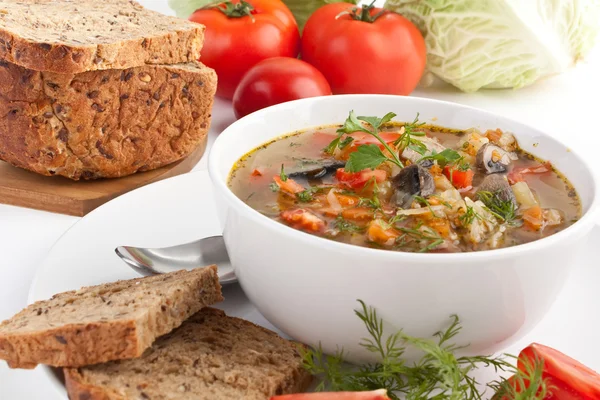 Serving of cabbage and mushroom soup with ingredients — Stock Photo, Image