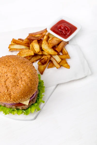 Hamburger with fries and sauce — Stock Photo, Image