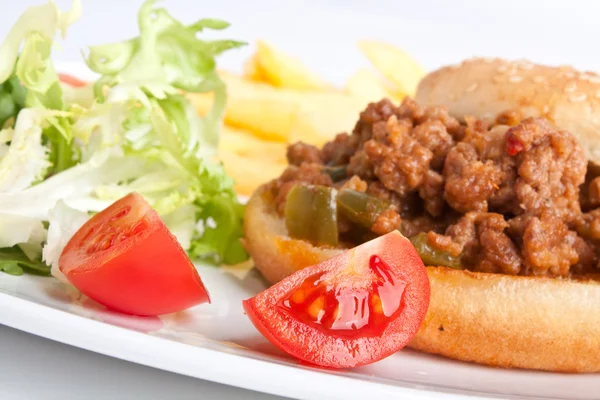 Minced meat burger with french fries and salad — Stock Photo, Image
