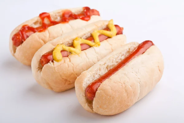 Three classic hot dogs — Stock Photo, Image