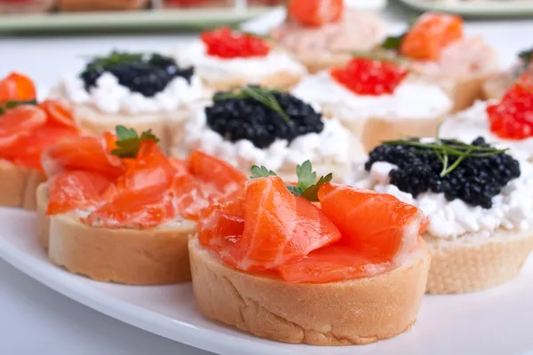 Large group of sandwiches with seafood — Stock Photo, Image