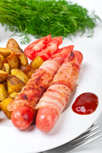 Sausages wrapped in bacon — Stock Photo, Image