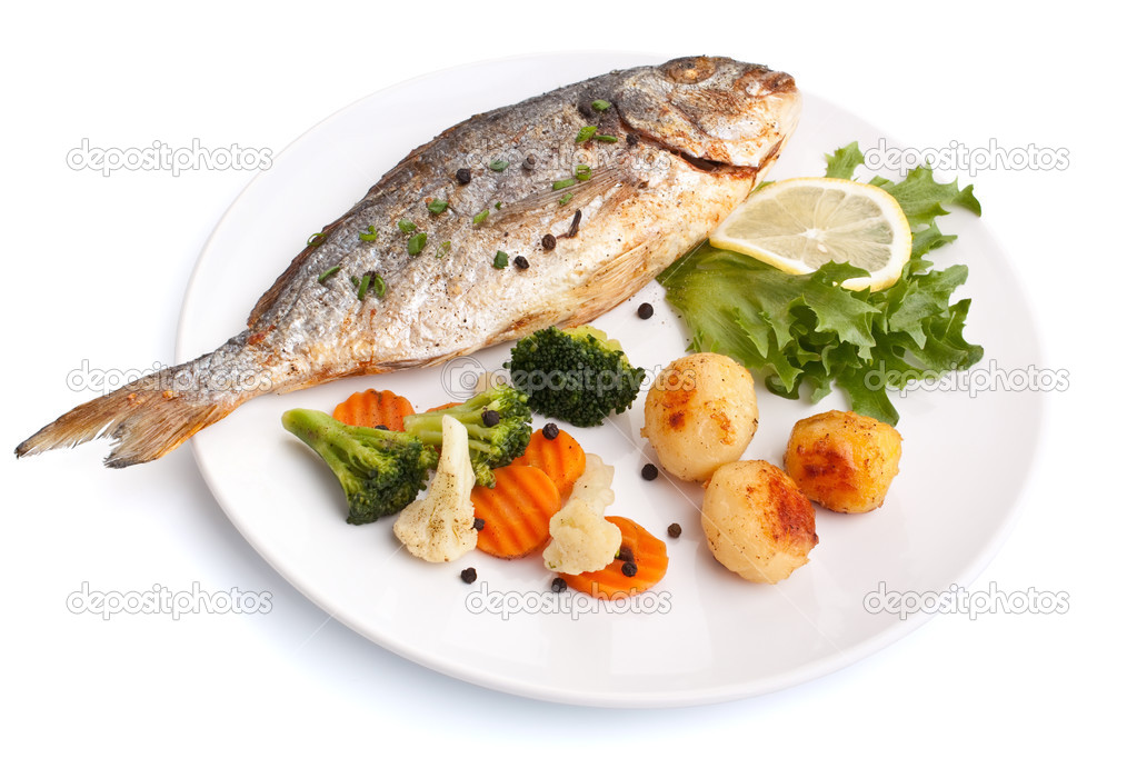 Sea Bream fish with vegetables on white plate