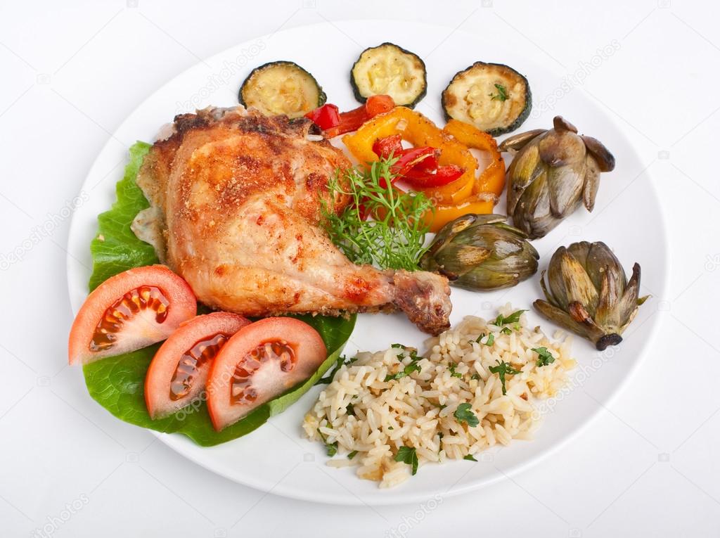 roasted chicken leg with rice and vegetables