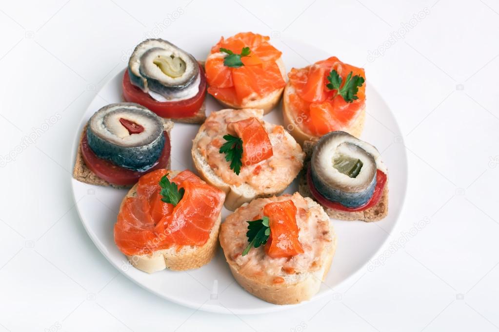 Sandwiches with  caviar, herring and salmon