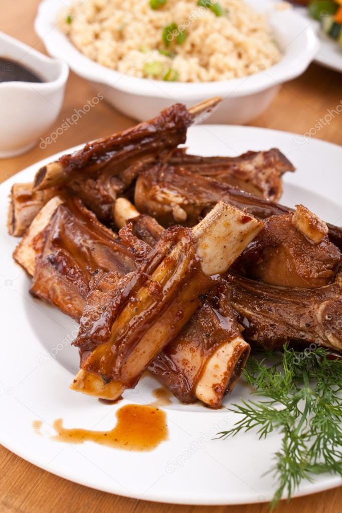 Barbecue ribs on a plate with vegetables