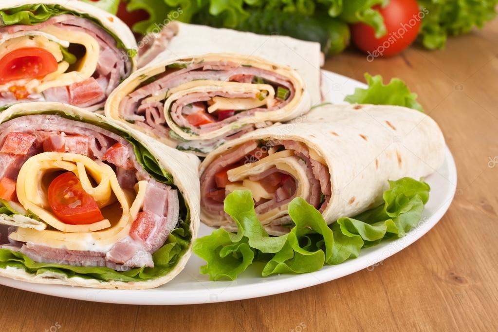 Wrapped tortilla sandwich rolls — Stock Photo © Nalga 41986529