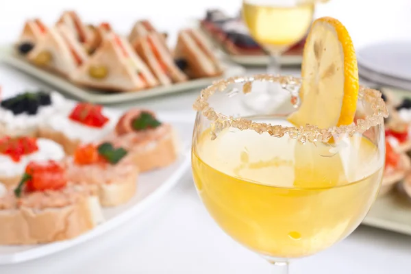 Table with drinks, sandwiches and canapes — Stock Photo, Image