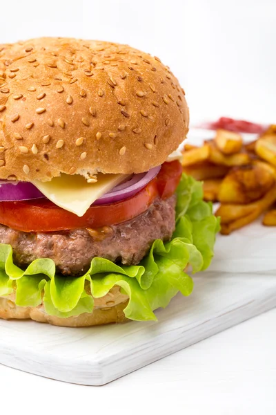 Hamburger with fries and sauce — Stock Photo, Image