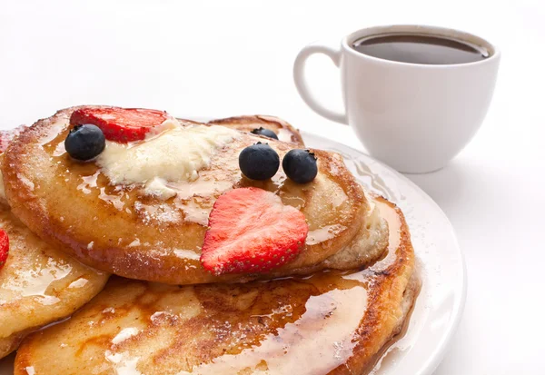 Pancakes with sweet cherry sauce — Stock Photo, Image