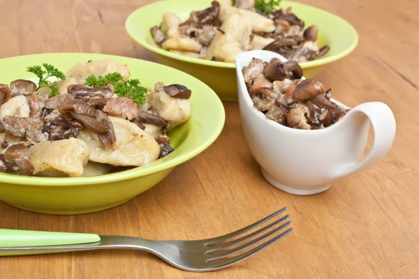 Gnocchi with sausage and porcini mushrooms sauce — Stock Photo, Image