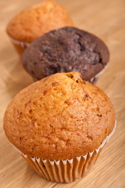 Three muffins in a row — Stock Photo, Image