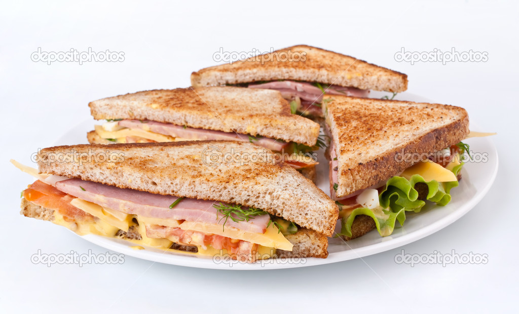 Meat, lettuce and cheese sandwiches on toasted bread