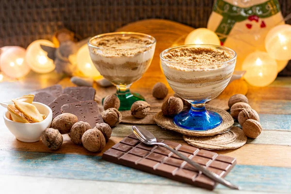 Winter milk-nut dessert in a glass, with walnuts and cookies
