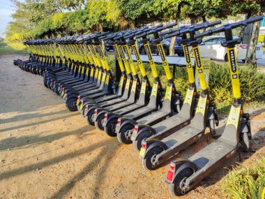Cyberjaya,Malaysia - 25 April 2022 : TRYKE e-scooters in the parking zone for rental at Perdana Lake, Cyberjaya Putrajaya.