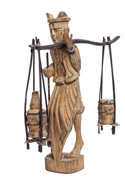 Statyett av mannen som bar på korgar på pinne — Stockfoto