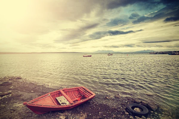 Vintage photo of a little fishing wooden boat — Stock Photo, Image